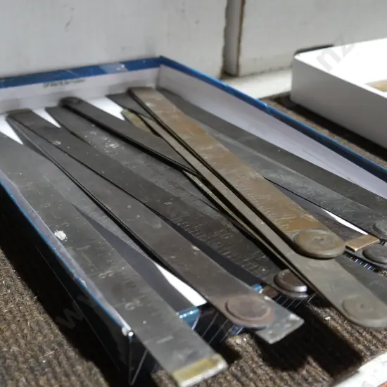 Folding metal rulers