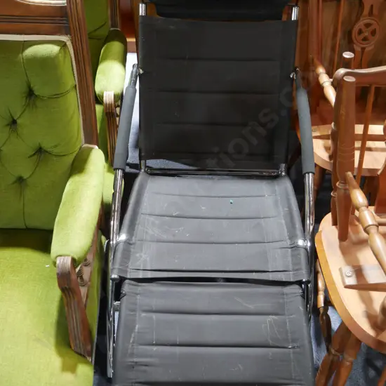 Black and chrome chair and footrest