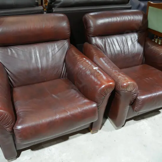 Pair of brown leather armchairs