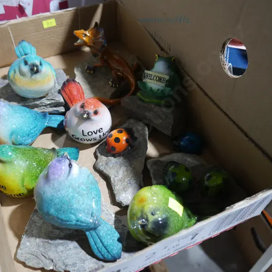Glass birds on rocks