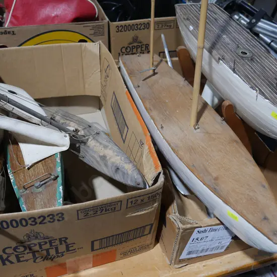 2 boxes of model boats