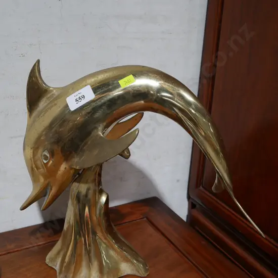 Dolphin ornament. brass