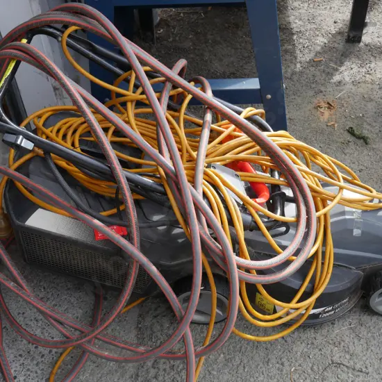 Ozito electric lawnmower, extension cord, garden hose