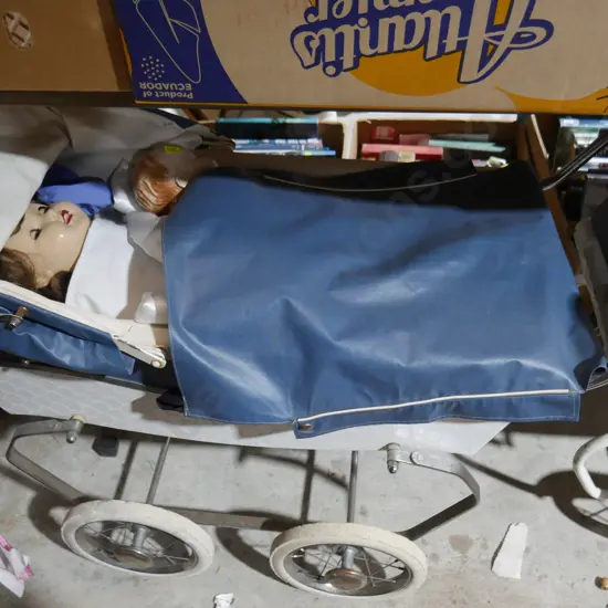 Two vintage doll prams and dolls