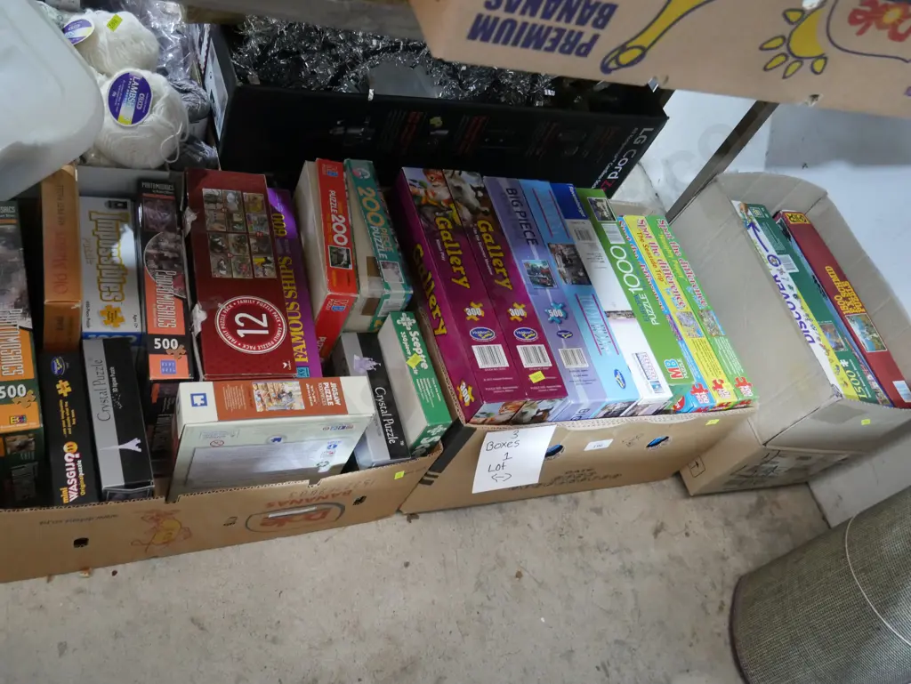 Three boxes of jigsaw puzzles Image 1++
