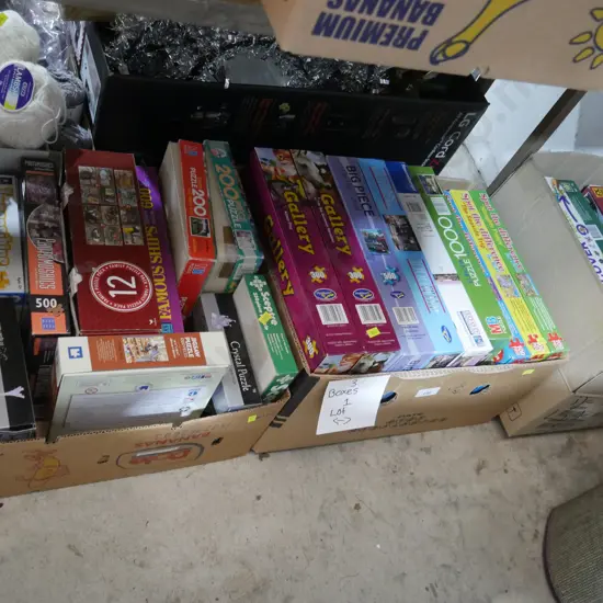 Three boxes of jigsaw puzzles