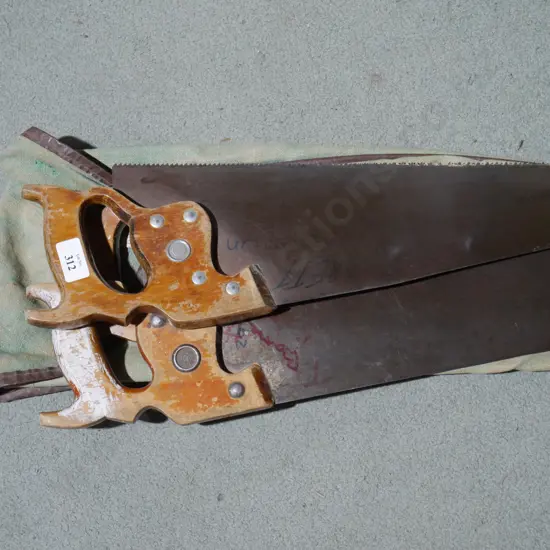 Three hand saws and bag