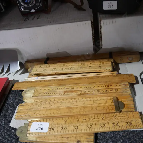 Folding wooden rules