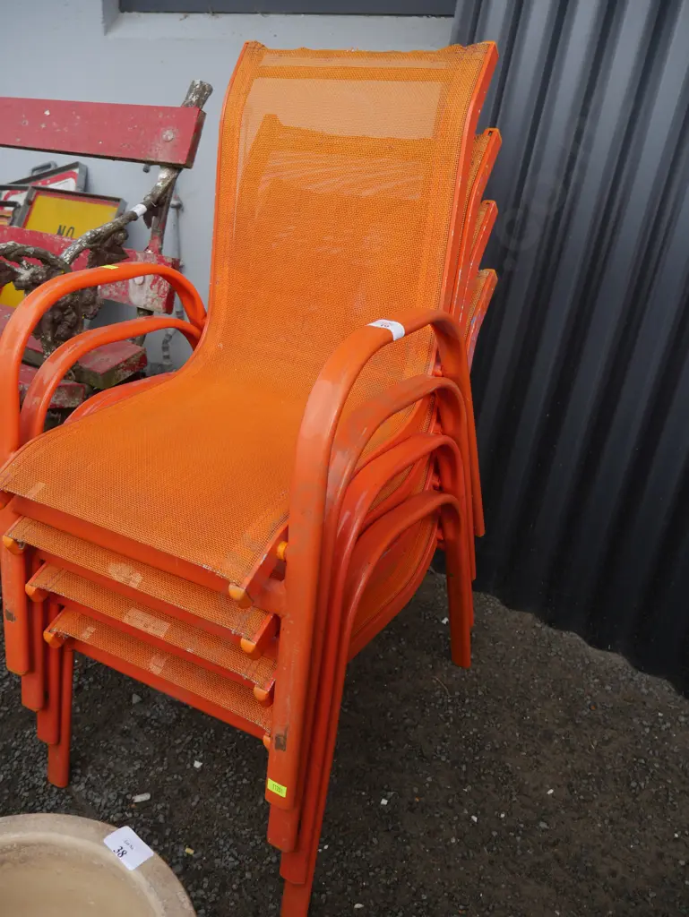 Stack of 4 orange children's chairs Image 1++
