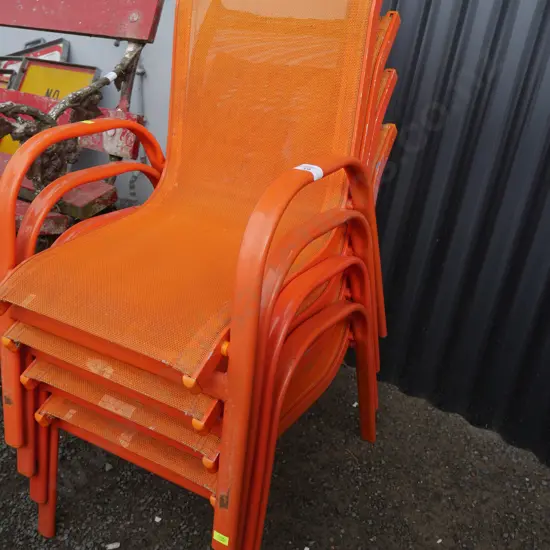 Stack of 4 orange children's chairs