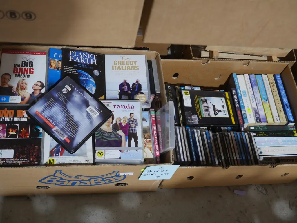 2 boxes DVDs, CDs, books Image 1++