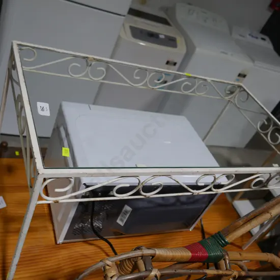 Wrought iron framed glass top coffee table