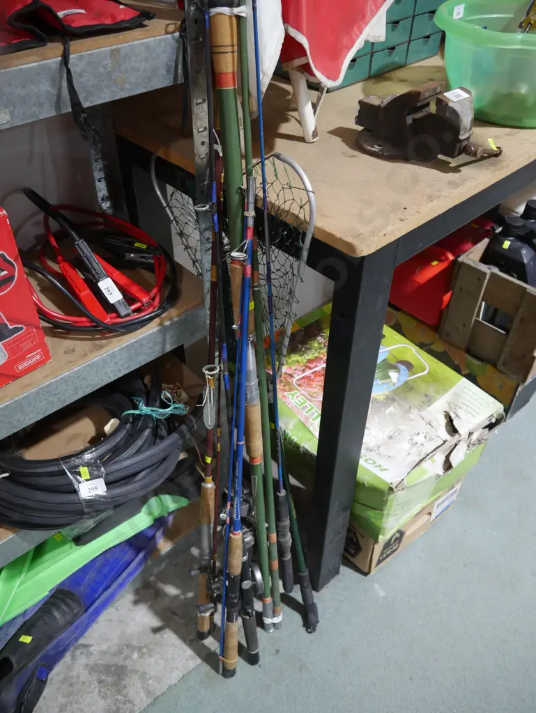 Assorted fishing rods and net Image 1++