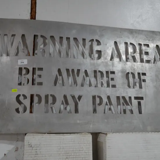 Spray paint area warning sign