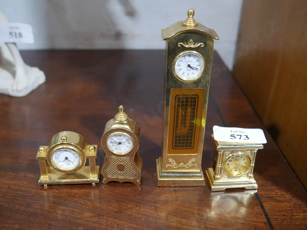 4 brass miniature clocks Image 1++