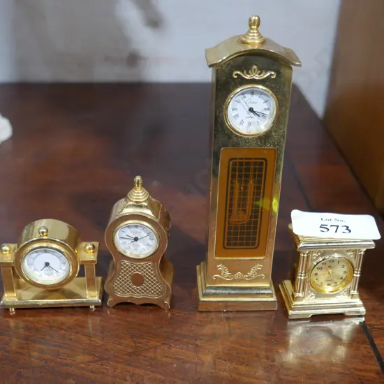 4 brass miniature clocks