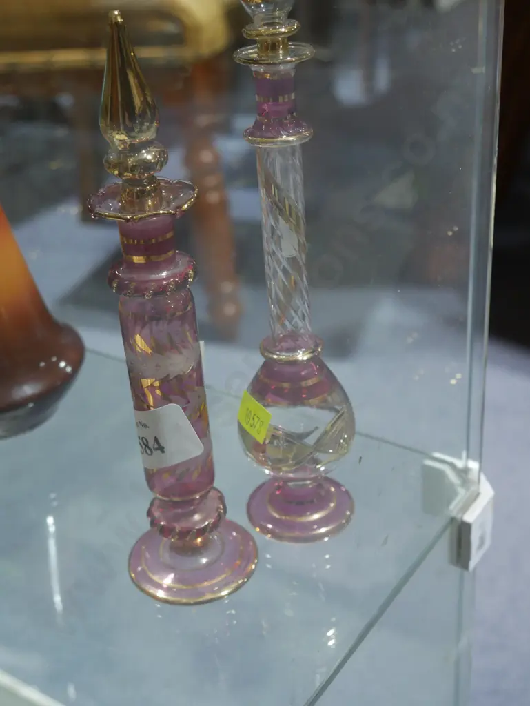 Two coloured glass stopped scent bottles Image 1++