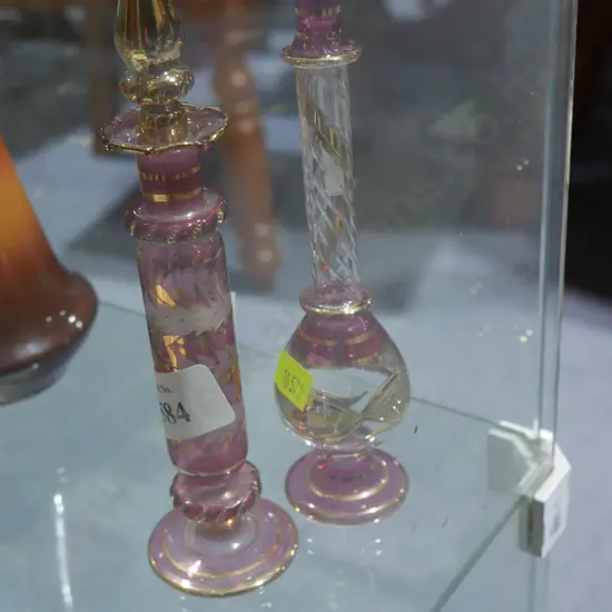 Two coloured glass stopped scent bottles