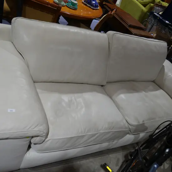 Cream leather 2 seater settee