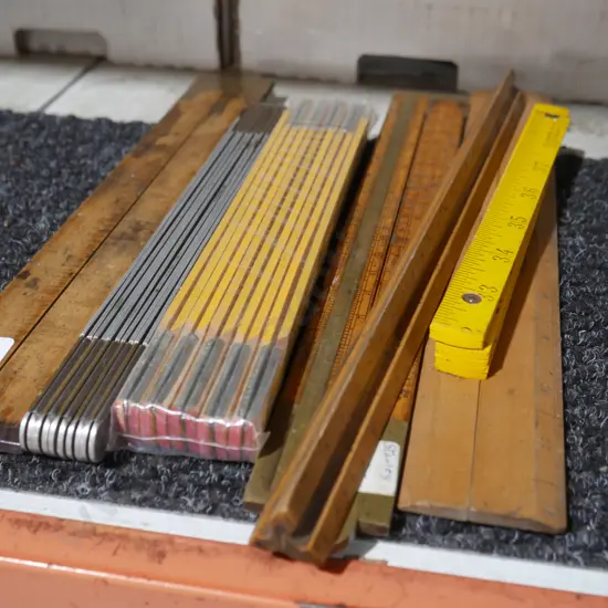 Assorted wooden rulers etc