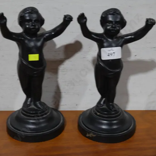Pair of heavy metal figurines