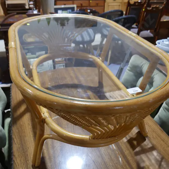 Glass top cane coffee table