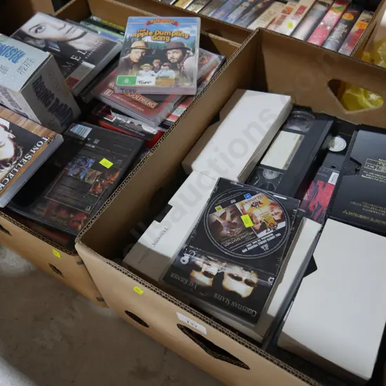 2 boxes of VHS tapes, DVD's