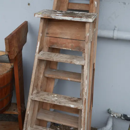 2 wooden step ladders