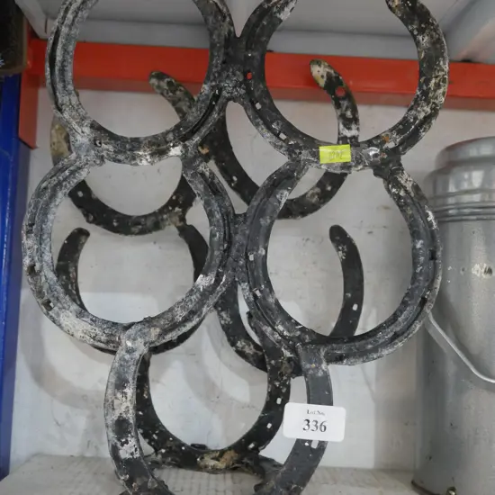 Horse shoe bottle holder