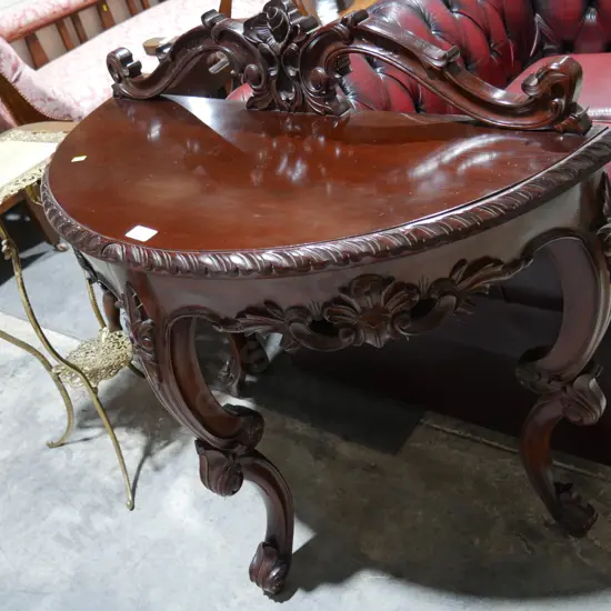 Ornate half round table