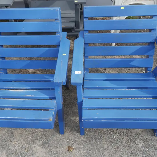 2 blue wooden outdoor armchairs