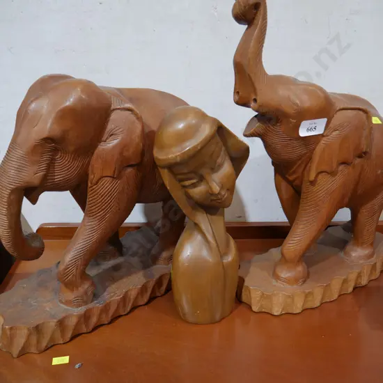 Elephants and lady wooden sculptures