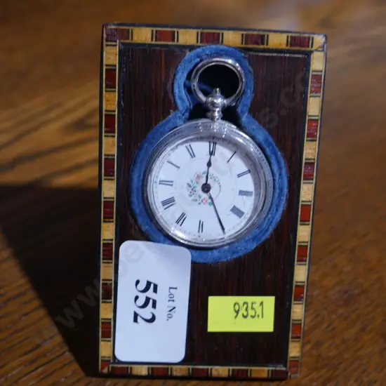 Silver pocket watch and stand