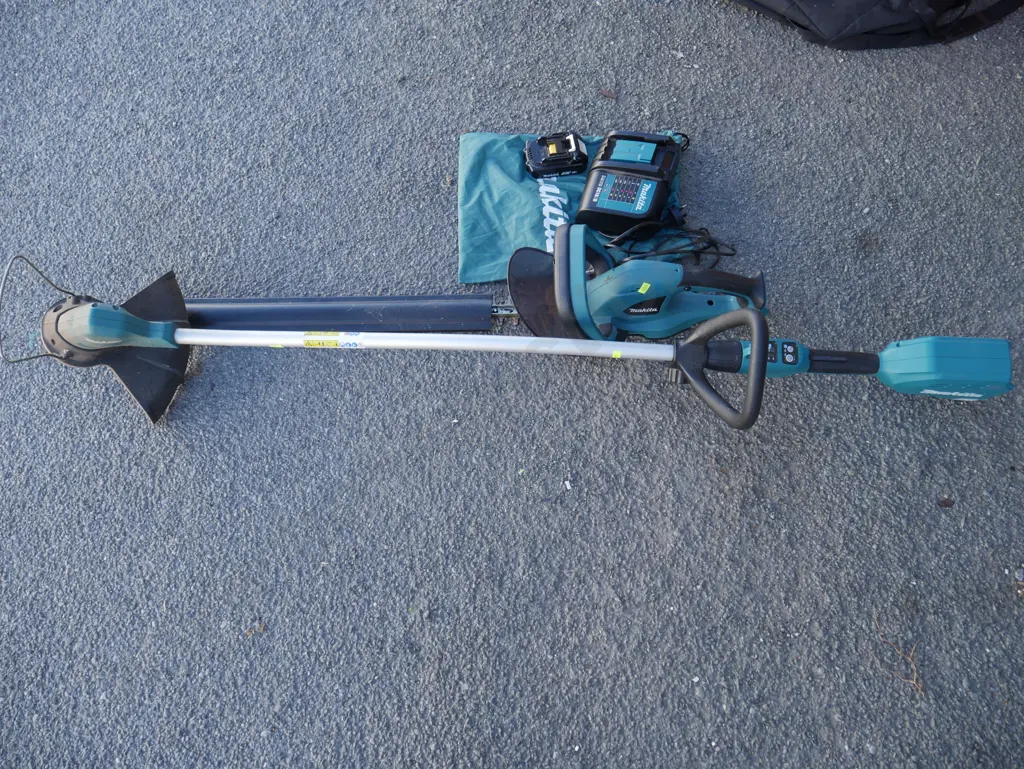 Makita battery hedge trimmer and weedeater with charger & battery Image 1++
