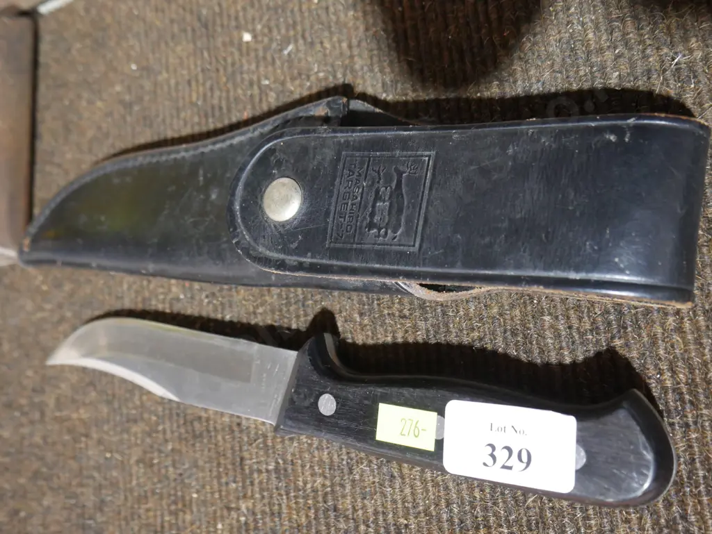 Knife and leather cover Image 1++