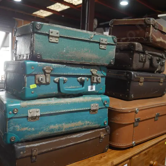 8 vintage suitcases