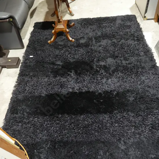 Black shaggy floor rug