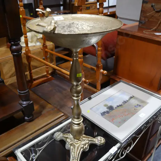 Gold painted bird bath