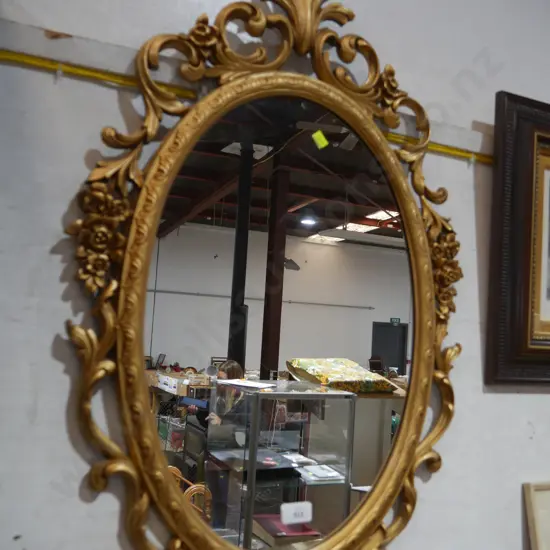 Gilt frame oval mirror
