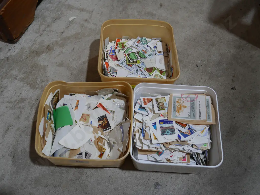 Three tubs of assorted stamps Image 1++