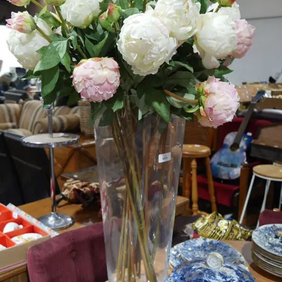 Large glass vase and imitation flowers