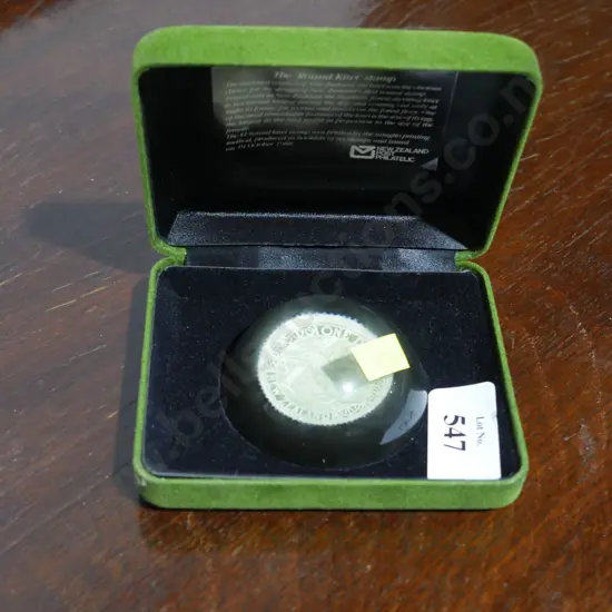 $1 stamp paperweight in case