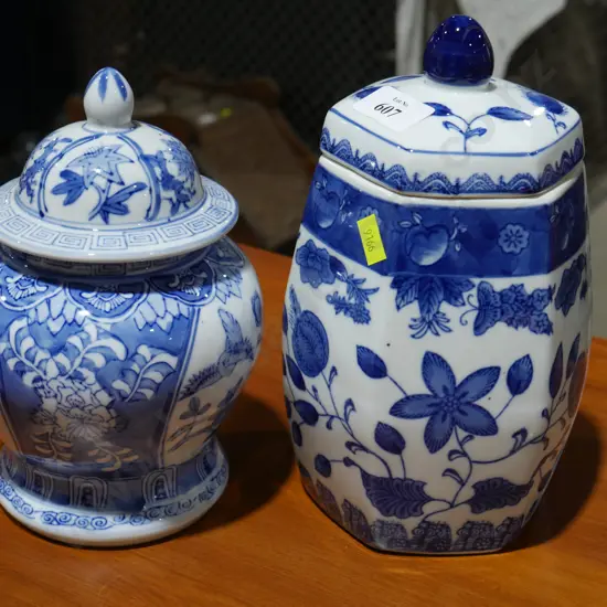 2 blue and white lidded jars