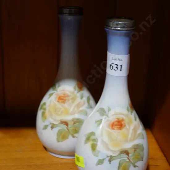 Pair of Stirling silver topped vases