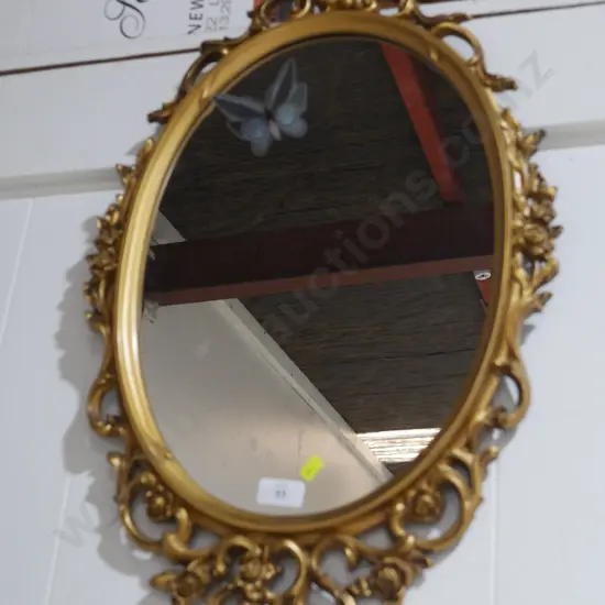 Oval gilt frame mirror