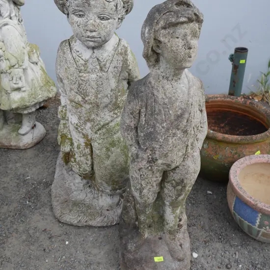 2 boy garden statues