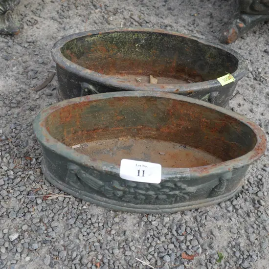 2 small cast iron planters
