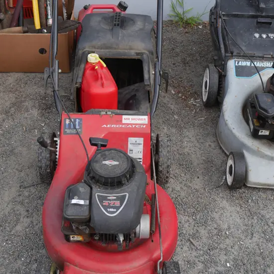 Lawnmaster lawn mower and 2 petrol cans