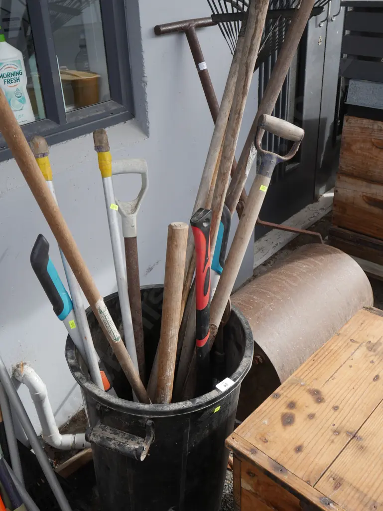 Assorted garden tools in bin Image 1++