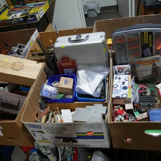 Six boxes of model train items